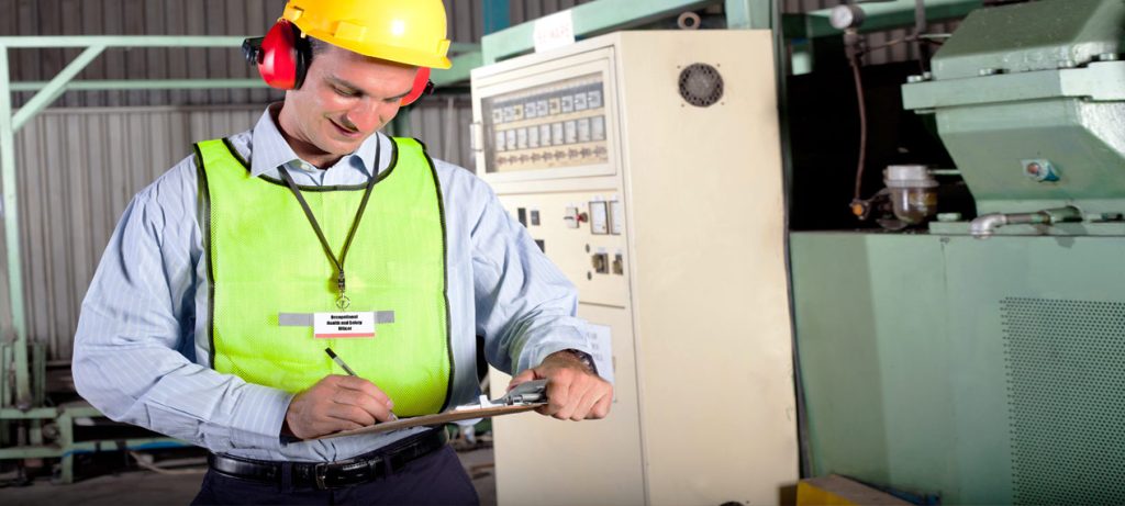 Occupational hygienist performing noise level testing during a noise survey in Ontario